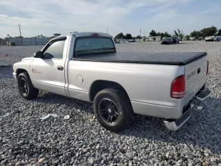 2001 Dodge Dakota с VIN 1B7FL26X31S345868, выставлен на аукционе Copart как лот 61427515 с пробегом 87 073 миль миль и Списание • Salvage title. История ставок и продаж доступна на DreamBid. Изображение 2.