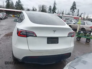 2021 Tesla Model Y Standard Range with VIN 5YJYGDED3MF103499, listed as a IAAI auction lot 41632064 with 132,846 mi miles and . Bid and sale history available at DreamBid. Image 16.