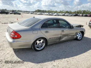 2003 Mercedes-Benz E-Class 5.0L with VIN WDBUF70J73A119596, listed as a Copart auction lot 77382424 with 237,620 mi miles and Salvage Title. Bid and sale history available at carsss.com. Image 3.