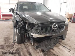 2015 Mazda CX-5 Grand Touring with VIN JM3KE4DYXF0467606, listed as a IAAI auction lot 41345790 with 107,915 mi miles. Bid and sale history available at carsss.com. Image 6.