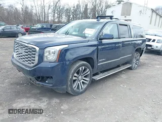 2020 GMC Yukon XL Denali with VIN 1GKS2HKJ3LR177072, listed as a IAAI auction lot 41879461 with 102,971 mi miles. Bid and sale history available at carsss.com. Image 2.