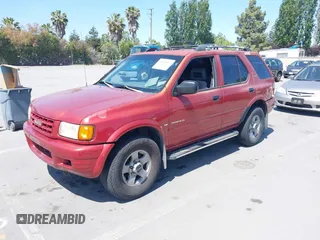 1999 Isuzu Rodeo S z VIN 4S2CK58WXX4346156, wystawiony jako IAAI lot #42328951 z przebiegiem 196 182 mil mil oraz . Historia ofert i sprzedaży dostępna na DreamBid. Obrazek 2.