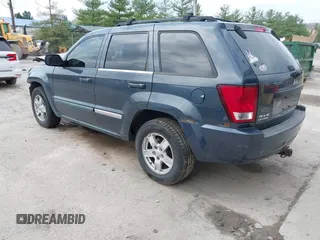 2007 Jeep Grand Cherokee Laredo with VIN 1J8GR48K07C692148, listed as a IAAI auction lot 42079608 with 245,605 mi miles. Bid and sale history available at carsss.com. Image 3.