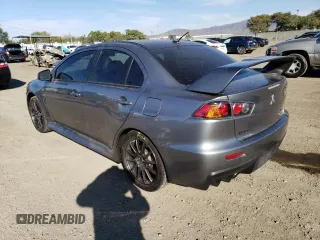 2015 Mitsubishi Lancer Evolution Final Edition z VIN JA32W7FV5FU028542, wystawiony jako Copart lot #67491522 z przebiegiem 83 173 mil mil oraz . Historia ofert i sprzedaży dostępna na DreamBid. Obrazek 2.