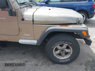 2005 Jeep Wrangler Sport with VIN 1J4FA49SX5P317120, listed as a IAAI auction lot 42677397 with 71,403 mi miles and . Bid and sale history available at DreamBid. Image 18.