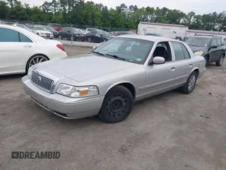 2006 Mercury Grand Marquis GS z VIN 2MEFM74V16X646802, wystawiony jako IAAI lot #42358697 z przebiegiem 169 321 mil mil oraz . Historia ofert i sprzedaży dostępna na DreamBid. Obrazek 2.