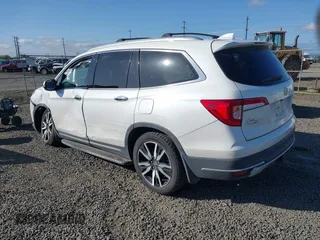 2021 Honda Pilot Touring 8-Passenger with VIN 5FNYF6H92MB031782, listed as a IAAI auction lot 42087322 with 70,062 mi miles and . Bid and sale history available at DreamBid. Image 3.