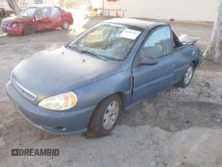 2002 Kia Rio with VIN KNADC123826128733, listed as a IAAI auction lot 41643123 with 101,433 mi miles. Bid and sale history available at carsss.com. Image 2.