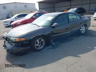 2003 Pontiac Bonneville SE z VIN 1G2HX52K934181238, wystawiony jako IAAI lot #41483636 z przebiegiem 176 737 mil mil oraz . Historia ofert i sprzedaży dostępna na DreamBid. Obrazek 2.