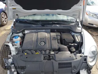 2014 Volkswagen Beetle 2.5L w/Sun with VIN 3VWJP7ATXEM628666, listed as a IAAI auction lot 41328014 with 70,990 mi miles and . Bid and sale history available at DreamBid. Image 10.