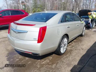 2013 Cadillac XTS Platinum z VIN 2G61U5S37D9209926, wystawiony jako IAAI lot #41754716 z przebiegiem 126 239 mil mil oraz . Historia ofert i sprzedaży dostępna na DreamBid. Obrazek 4.