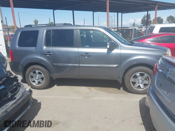 2011 Honda Pilot Touring with VIN 5FNYF4H96BB083532, listed as a IAAI auction lot 41926177 with 100,815 mi miles. Bid and sale history available at carsss.com. Image 14.