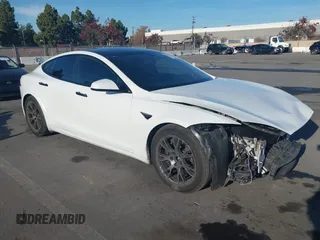 2023 Tesla Model S with VIN 5YJSA1E50PF500073, listed as a IAAI auction lot 41048840 with 74,324 mi miles and . Bid and sale history available at DreamBid. Image 1.