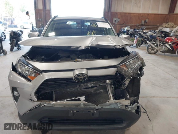2021 Toyota RAV4 XLE with VIN 2T3P1RFV5MC180890, listed as a IAAI auction lot 42567858 with 56,961 mi miles and . Bid and sale history available at DreamBid. Image 11.