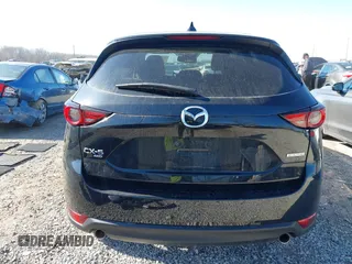 2021 Mazda CX-5 Grand Touring with VIN JM3KFBDM0M0468081, listed as a IAAI auction lot 41894411 with 54,664 mi miles. Bid and sale history available at carsss.com. Image 17.