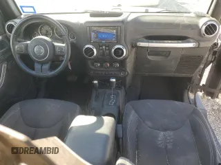 2015 Jeep Wrangler Sahara with VIN 1C4AJWBG5FL733795, listed as a Copart auction lot 61998255 with 86,655 mi miles and Salvage title. Bid and sale history available at DreamBid. Image 8.
