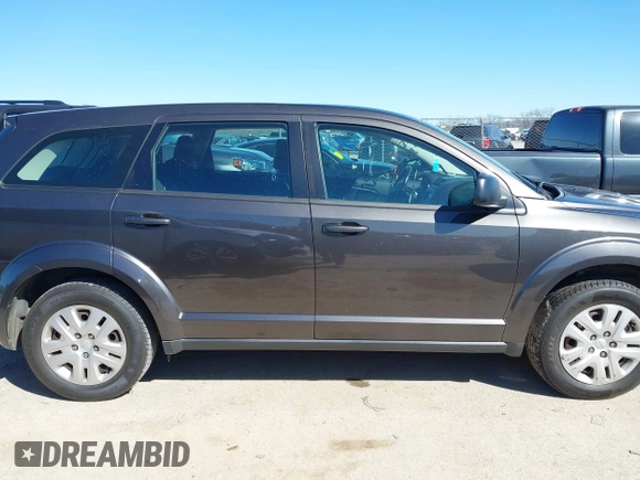 2015 Dodge Journey SE z VIN 3C4PDCAB5FT739266, wystawiony jako IAAI lot #41725086 z przebiegiem 134 109 mil mil oraz . Historia ofert i sprzedaży dostępna na DreamBid. Obrazek 13.