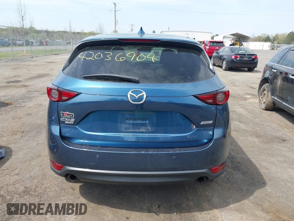 2019 Mazda CX-5 Signature with VIN JM3KFBEY1K0512880, listed as a IAAI auction lot 42036904 with 92,650 mi miles. Bid and sale history available at carsss.com. Image 17.