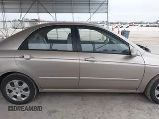 2004 Kia Spectra LX with VIN KNAFE121245064294, listed as a IAAI auction lot 41424241 with 110,136 mi miles. Bid and sale history available at carsss.com. Image 13.