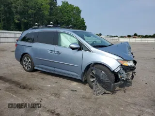 2014 Honda Odyssey Touring with VIN 5FNRL5H95EB080449, listed as a Copart auction lot 58489715 with 154,604 mi miles and Salvage title. Bid and sale history available at DreamBid. Image 4.
