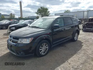 2013 Dodge Journey SXT with VIN 3C4PDDBG7DT553130, listed as a IAAI auction lot 40570369 with Not Provided miles and . Bid and sale history available at DreamBid. Image 2.