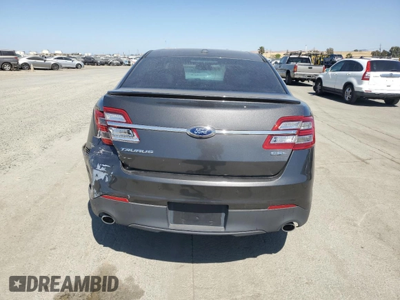 2015 Ford Taurus SEL with VIN 1FAHP2E8XFG209390, listed as a Copart auction lot 58992305 with 99,498 mi miles and Salvage title. Bid and sale history available at DreamBid. Image 6.