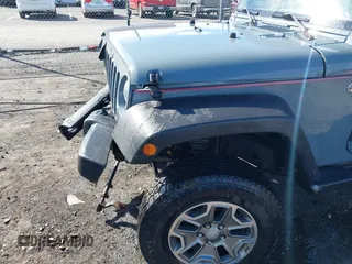 2015 Jeep Wrangler Unlimited Willys Wheeler with VIN 1C4BJWDG4FL589822, listed as a IAAI auction lot 41732614 with 149,112 mi miles and . Bid and sale history available at DreamBid. Image 19.