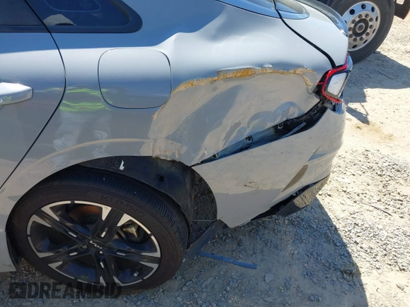 2022 Kia K5 GT-Line z VIN 5XXG64J23NG156401, wystawiony jako IAAI lot #42051123 z przebiegiem 71 853 mil mil oraz . Historia ofert i sprzedaży dostępna na DreamBid. Obrazek 17.