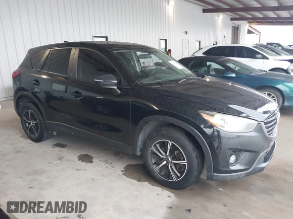 2016 Mazda CX-5 Touring with VIN JM3KE2CY2G0808424, listed as a IAAI auction lot 41880494 with 149,005 mi miles. Bid and sale history available at carsss.com. Image 13.