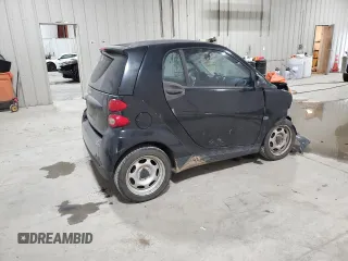 2011 Smart fortwo Pure с VIN WMEEJ3BA5BK480412, выставлен на аукционе Copart как лот 87023194 с пробегом 70 496 миль миль и Списание • Salvage title. История ставок и продаж доступна на DreamBid. Изображение 3.