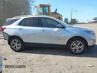 2018 Chevrolet Equinox Premier with VIN 3GNAXVEV4JS598239, listed as a IAAI auction lot 42112886 with 142,093 mi miles and . Bid and sale history available at DreamBid. Image 14.