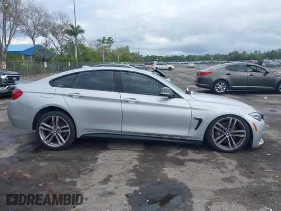2018 BMW 4 Series 440i with VIN WBA4J5C57JBF07227, listed as a IAAI auction lot 41562986 with 76,316 mi miles and . Bid and sale history available at DreamBid. Image 13.