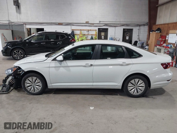 2019 Volkswagen Jetta S z VIN 3VWC57BU6KM129512, wystawiony jako IAAI lot #42205228 z przebiegiem 92 940 mil mil oraz . Historia ofert i sprzedaży dostępna na DreamBid. Obrazek 13.