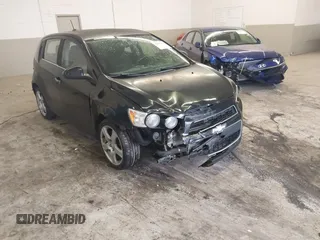 2016 Chevrolet Sonic LTZ z VIN 1G1JE6SB3G4150803, wystawiony jako IAAI lot #42007951 z przebiegiem 124 811 mil mil oraz . Historia ofert i sprzedaży dostępna na DreamBid. Obrazek 1.