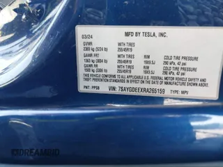 2024 Tesla Model Y Long Range with VIN 7SAYGDEEXRA265159, listed as a IAAI auction lot 40907008 with Not Provided miles and . Bid and sale history available at DreamBid. Image 9.