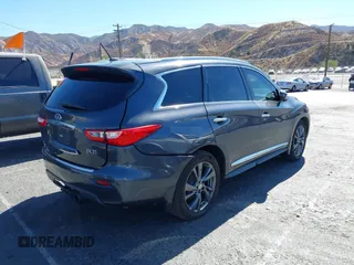 2013 Infiniti JX35 with VIN 5N1AL0MM8DC317601, listed as a IAAI auction lot 40678694 with 142,221 mi miles and . Bid and sale history available at DreamBid. Image 4.