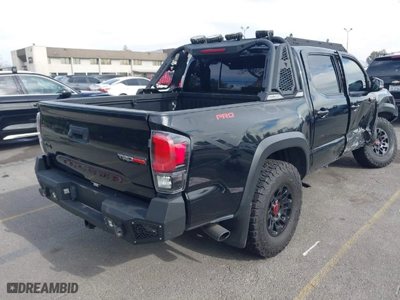 2019 Toyota Tacoma 4WD SR with VIN 5TFCZ5AN5KX193668, listed as a IAAI auction lot 41248429 with 60,812 mi miles. Bid and sale history available at carsss.com. Image 4.