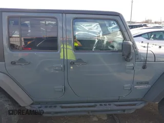 2014 Jeep Wrangler Unlimited Sport with VIN 1C4BJWDG9EL309763, listed as a IAAI auction lot 41378132 with 117,029 mi miles. Bid and sale history available at carsss.com. Image 13.
