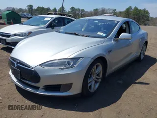 2015 Tesla Model S 85D with VIN 5YJSA1H2XFF084145, listed as a IAAI auction lot 42101755 with 105,660 mi miles. Bid and sale history available at carsss.com. Image 2.