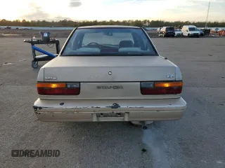 1990 Nissan Stanza GXE z VIN JN1FU21P9LX822087, wystawiony jako Copart lot #82967984 z przebiegiem 109 985 mil mil oraz Tytuł czysty. Historia ofert i sprzedaży dostępna na DreamBid. Obrazek 6.