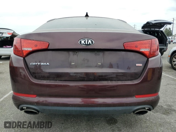 2013 Kia Optima LX z VIN 5XXGM4A74DG102024, wystawiony jako Copart lot #58264275 z przebiegiem 128 594 mil mil oraz Szkoda całkowita • Salvage title. Historia ofert i sprzedaży dostępna na DreamBid. Obrazek 6.