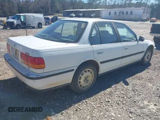 1992 Honda Accord LX with VIN JHMCB7659NC048944, listed as a IAAI auction lot 41704471 with 253,535 mi miles. Bid and sale history available at carsss.com. Image 4.