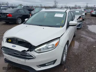 2015 Ford Focus Titanium with VIN 1FADP3N23FL293432, listed as a IAAI auction lot 41929774 with 100,865 mi miles. Bid and sale history available at carsss.com. Image 2.