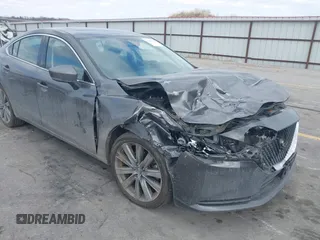2020 Mazda 6 Grand Touring with VIN JM1GL1TY6L1525169, listed as a IAAI auction lot 41683512 with 73,313 mi miles and . Bid and sale history available at carsss.com. Image 1.