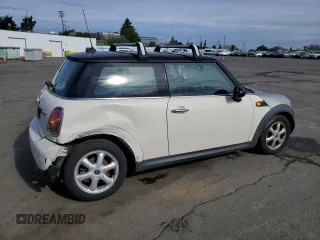2010 MINI Hardtop with VIN WMWMF3C57ATU77370, listed as a Copart auction lot 50078605 with 187,187 mi miles and Salvage title. Bid and sale history available at DreamBid. Image 3.