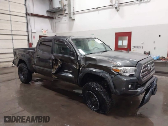 2017 Toyota Tacoma SR5 with VIN 3TMDZ5BN8HM016825, listed as a IAAI auction lot 41658400 with 166,098 mi miles. Bid and sale history available at carsss.com. Image 1.