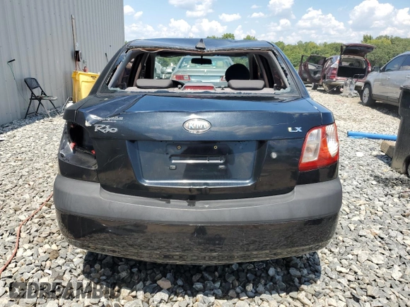 2009 Kia Rio LX with VIN KNADE223296539006, listed as a Copart auction lot 69229394 with 227,766 mi miles and Salvage Title. Bid and sale history available at DreamBid. Image 6.