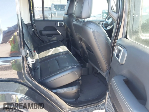 2023 Jeep Wrangler Sahara z VIN 1C4JJXP60PW627051, wystawiony jako IAAI lot #42290712 z przebiegiem 28 269 mil mil oraz . Historia ofert i sprzedaży dostępna na DreamBid. Obrazek 8.