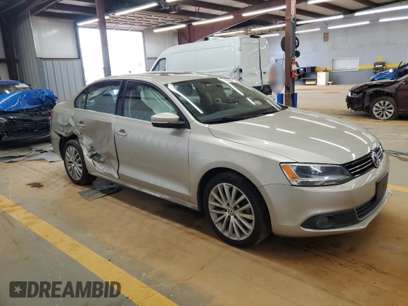 2014 Volkswagen Jetta TDI w/Premium with VIN 3VWLL7AJ9EM261908, listed as a Copart auction lot 60703205 with 128,892 mi miles and Salvage title. Bid and sale history available at DreamBid. Image 4.