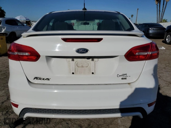 2016 Ford Focus SE with VIN 1FADP3F26GL336032, listed as a Copart auction lot 48334005 with 107,527 mi miles and Clean title. Bid and sale history available at DreamBid. Image 6.